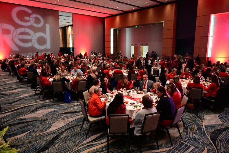 Photo of full ballroom with Go Red for Women projected on one wall